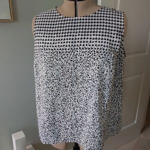 Mixed pattern Talbots sleeveless shell. Top zip in back. Split hem. 26" length.